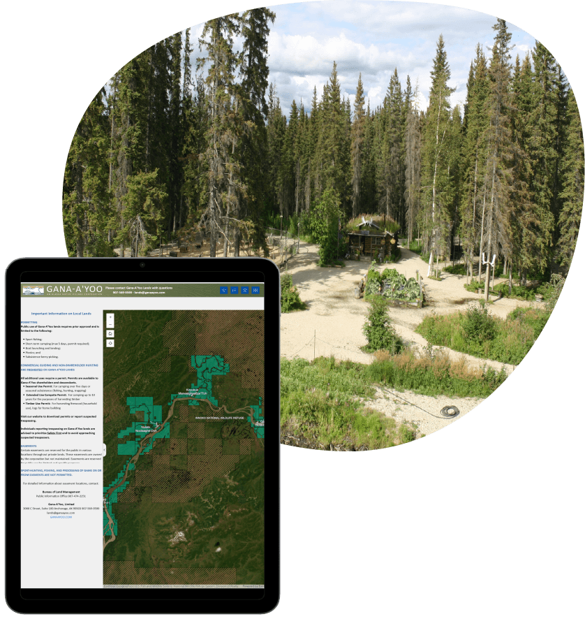 tablet map display with a photo of trees and a house behind