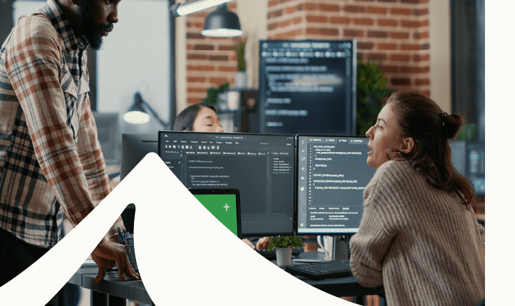 two people surrounded by digital screens and white mountain swoop